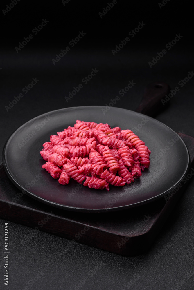 Delicious fusilli pasta with beetroot pesto, parmesan, salt and spices Delicious fusilli pasta with beetroot pesto, parmesan, salt and spices