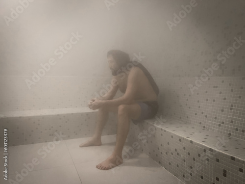 Man in steam room photo