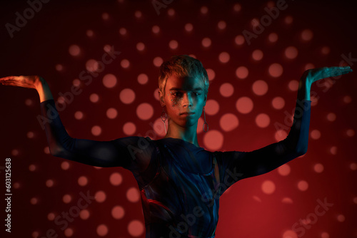 Queer Man Posing In Dark Studio