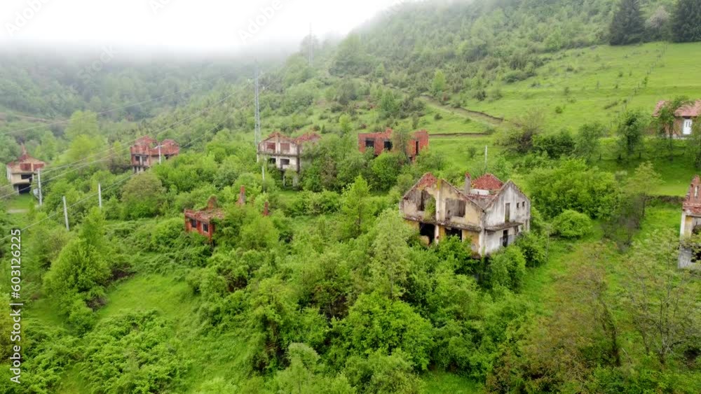 Destroyed houses in village as war aftermath, aerial drone view. Houses destroyed and burned by artillery during the war . Abandoned buildings. Houses in ruins. Destroyed houses in village as war aftermath, aerial drone view. Houses destroyed and burned by artillery during the war . Abandoned buildings. Houses in ruins.