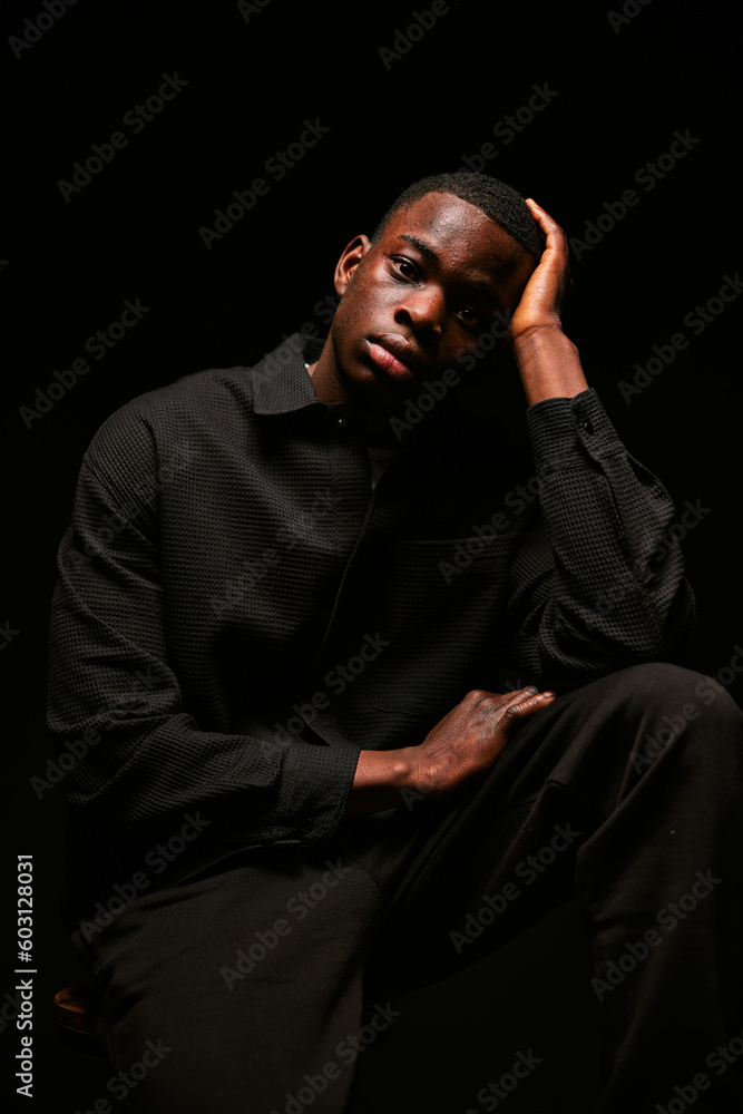 Stylish man in dark room Stylish man in dark room