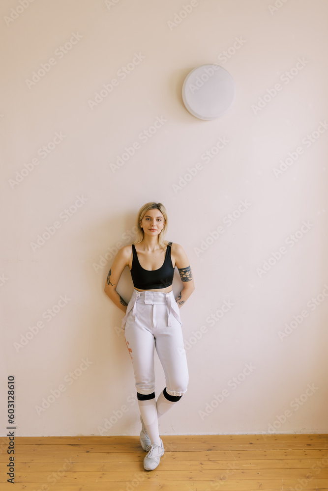 portrait of young woman with fencing uniform portrait of young woman with fencing uniform