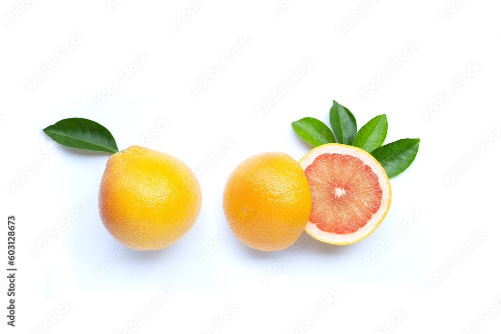 High vitamin C. Juicy grapefruit with leaves on white background. Copy space