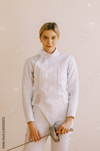 portrait of young woman with fencing uniform