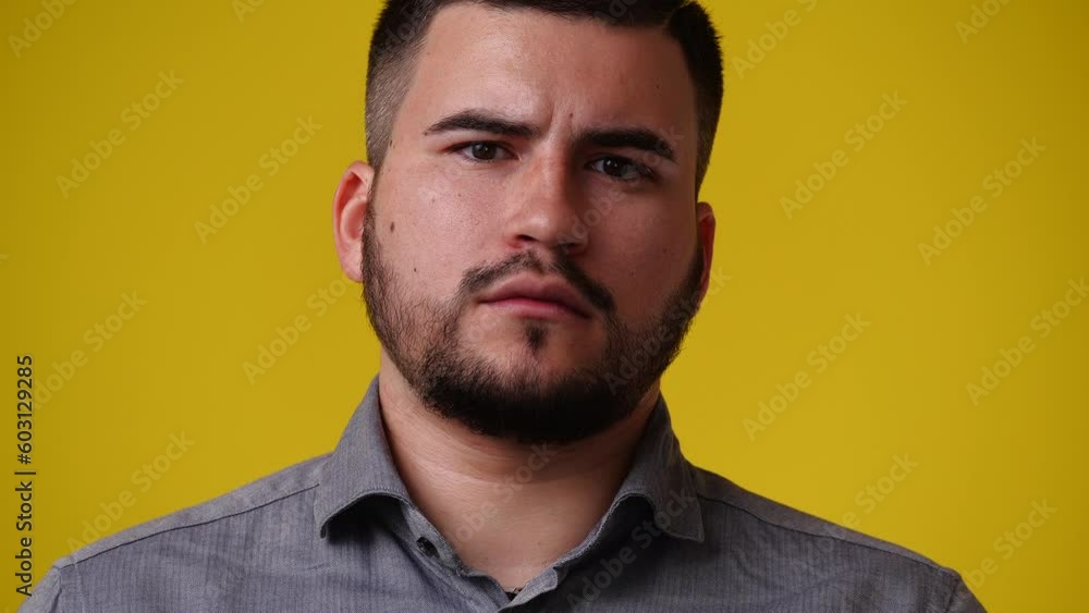 4k video of one man with a beard who posing over yellow background. 4k video of one man with a beard who posing over yellow background.