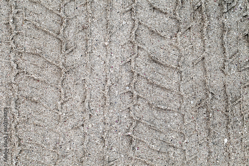 Car tire print on gray sand close-up Car tire print on gray sand close-up