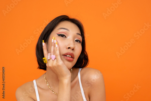 Stylish woman with trendy rings of the 2000s photo