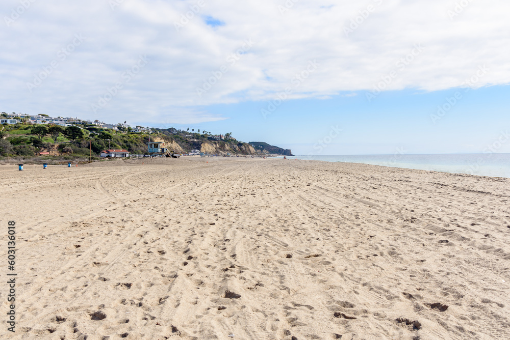 Large sandy beach along the coast of California on a partly cloudy autumn day Large sandy beach along the coast of California on a partly cloudy autumn day