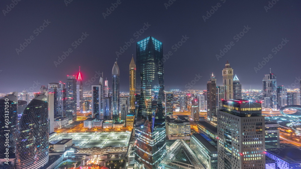 Obraz premium Panorama of futuristic skyscrapers in financial district business center in Dubai all night timelapse