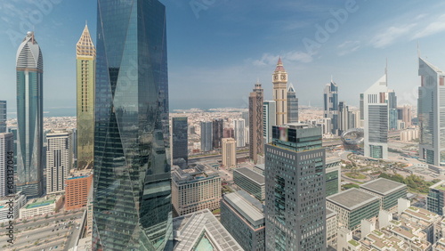Panorama showing futuristic skyscrapers in financial district business center in Dubai on Sheikh Zayed road timelapse © neiezhmakov
