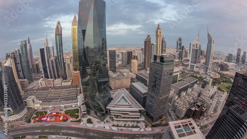 Panorama of futuristic skyscrapers in financial district business center in Dubai night to day timelapse © neiezhmakov