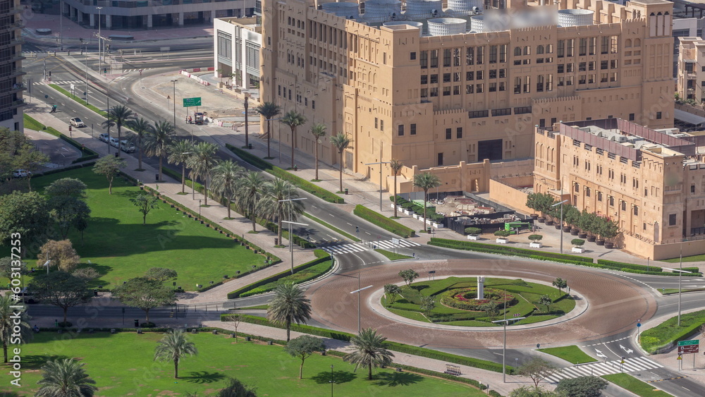 Aerial view of a roundabout circle road intersection in Dubai downtown from above timelapse.