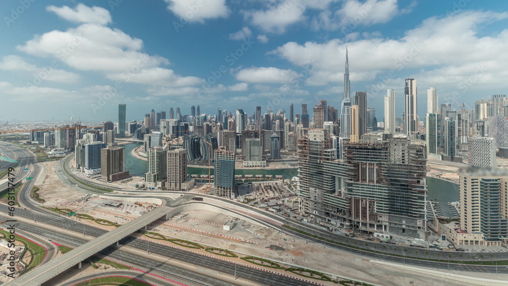 Obraz premium Panorama showing skyline of Dubai with business bay and downtown district timelapse.