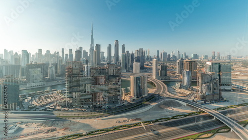 Panoramic skyline of Dubai with business bay and downtown district all day timelapse.