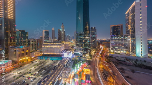 Dubai International Financial district aerial day to night timelapse. Panoramic view of business and financial office towers.