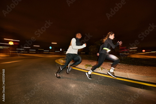 Energetic diverse people running together on street photo