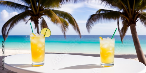 A yellow cocktail in a glass on a white table against the background of a sea beach on a bright sunny day under palm trees. Generative AI. © Sergiy