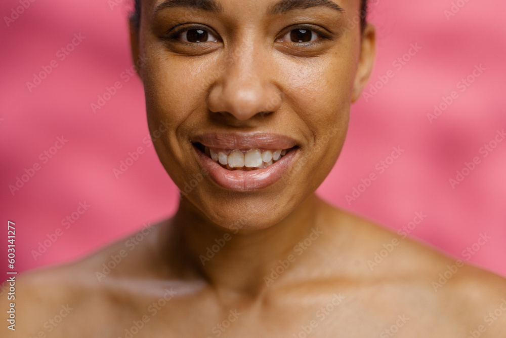 A woman smiles while posing in the studio A woman smiles while posing in the studio