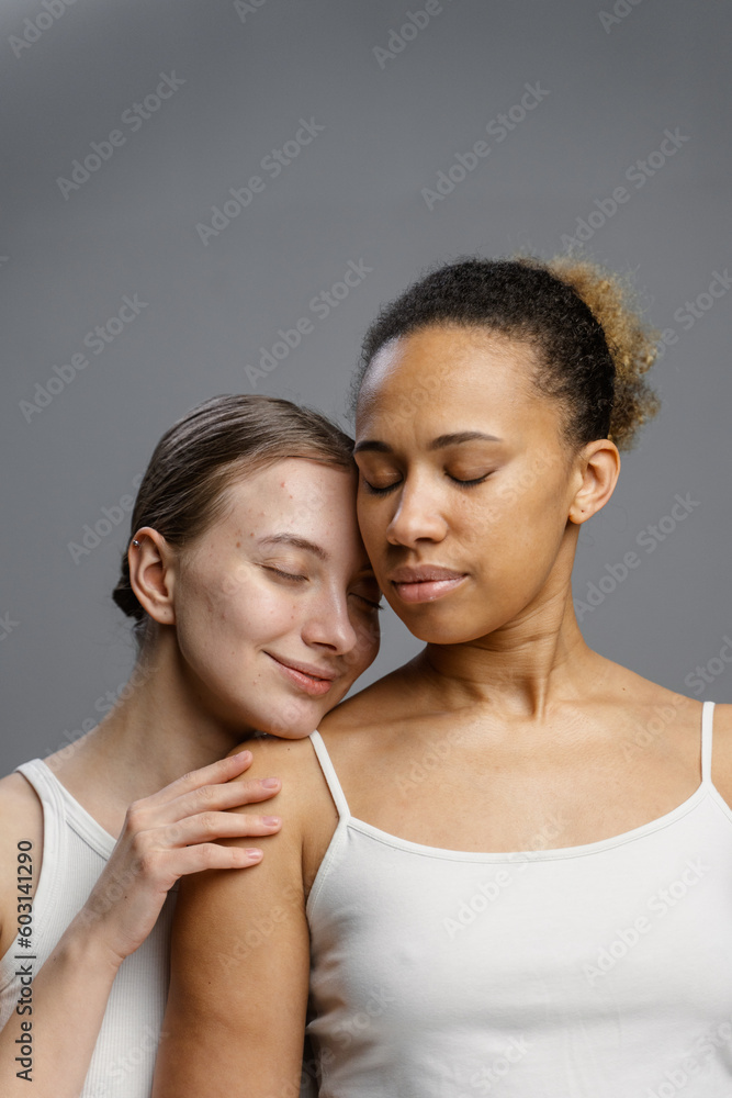 Two women pose in the studio Two women pose in the studio