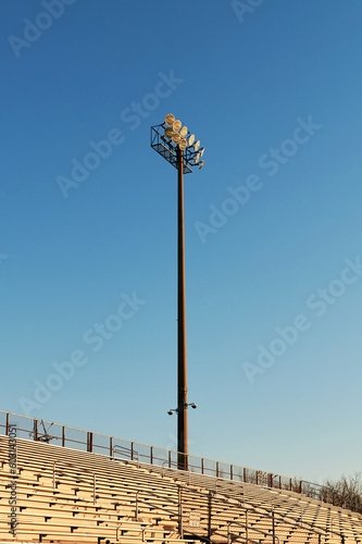 An Empty Stadium Stand against a blue sky, sunrise 