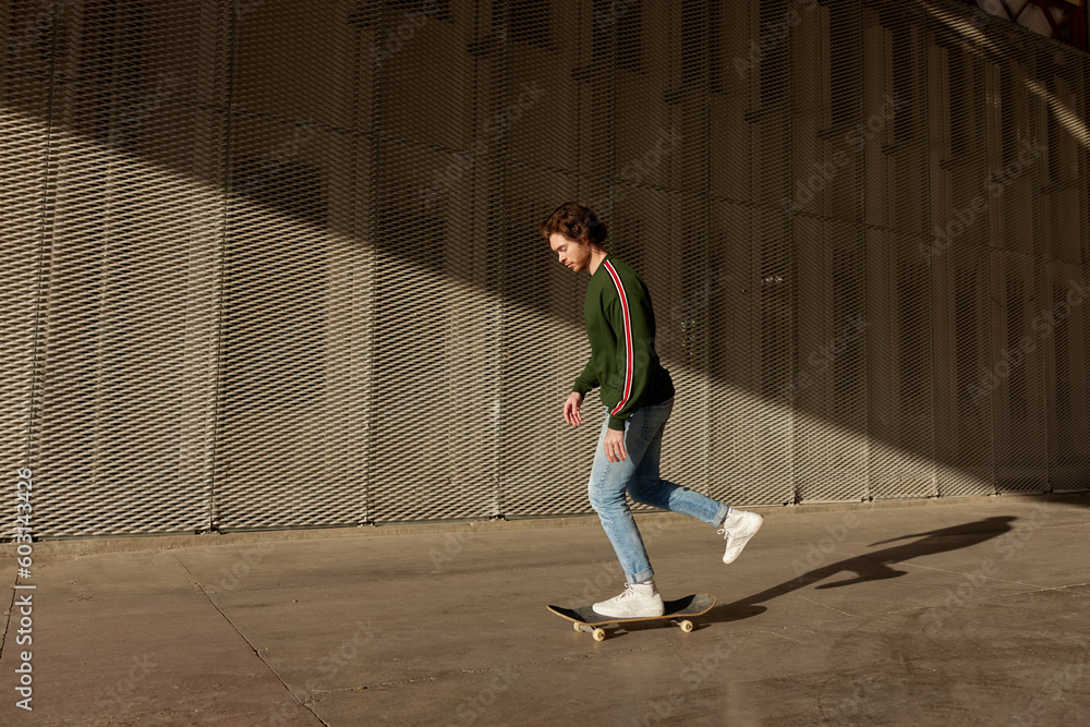Energetic guy riding skateboard Energetic guy riding skateboard