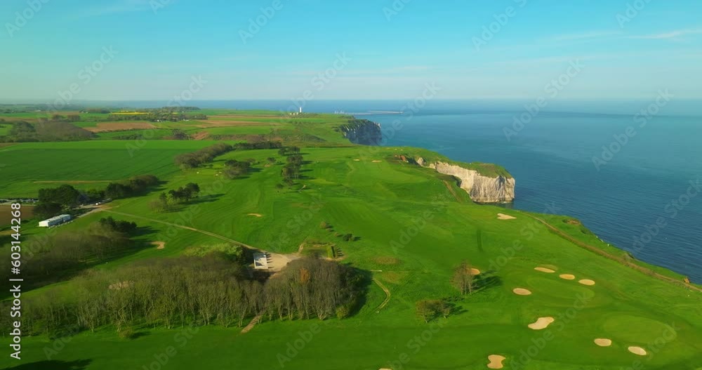 Drone shot of French golf courses located on the coast of the Atlantic Ocean. Fresh, clean air and walks on green golf meadows in the early morning and a healthy lifestyle for elderly, rich people Drone shot of French golf courses located on the coast of the Atlantic Ocean. Fresh, clean air and walks on green golf meadows in the early morning and a healthy lifestyle for elderly, rich people