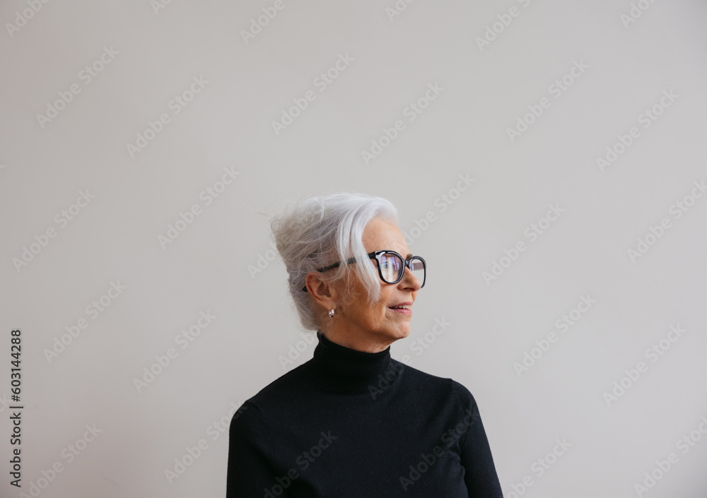 Woman in simple studio with serious expression. Woman in simple studio with serious expression.