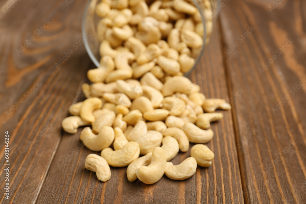 Heap of tasty cashew nut on wooden background Heap of tasty cashew nut on wooden background
