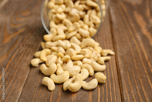Heap of tasty cashew nut on wooden background