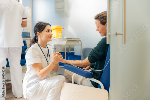 Female patient listening to doctor photo