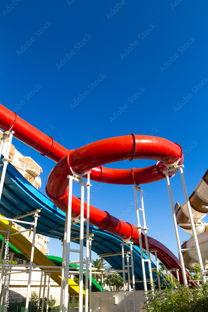 Water fun recreation playground, with bright multi-colored slides without people on a summer day