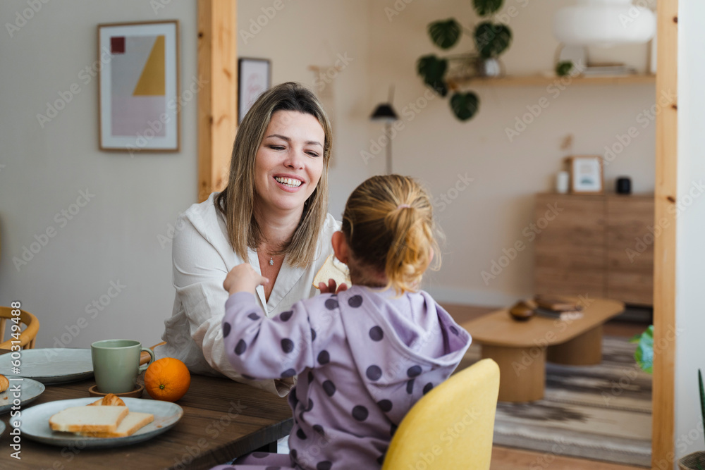 Family Having Breakfast Together At Home