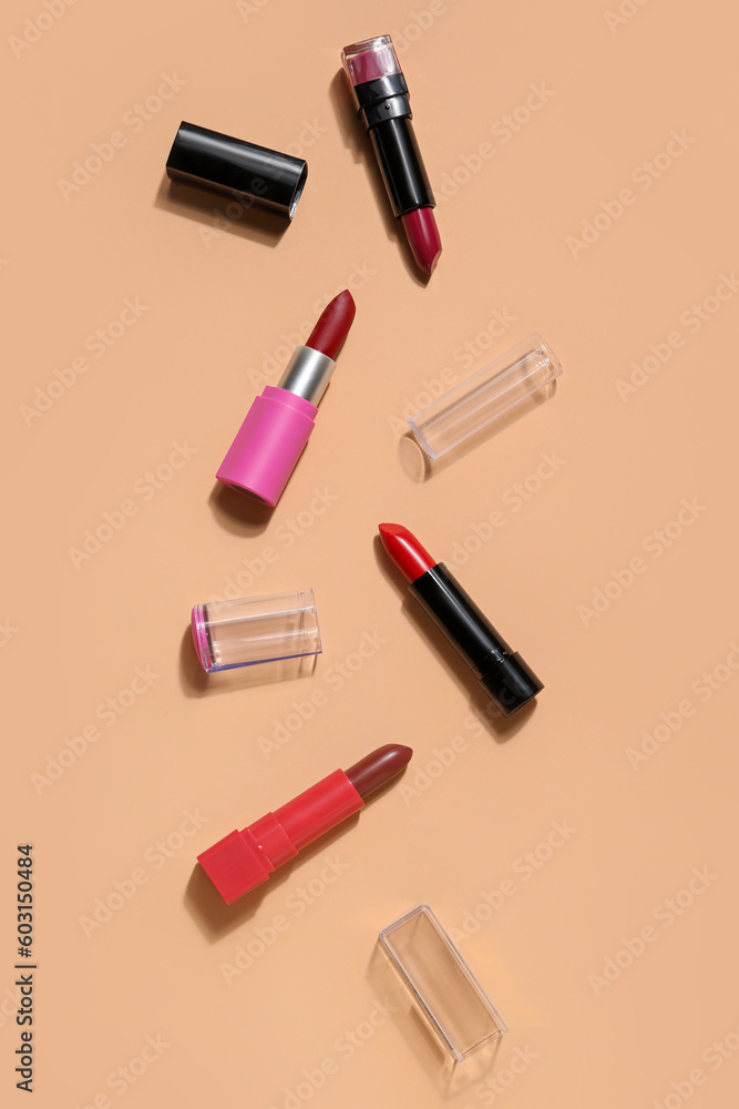 Different lipsticks on beige background Different lipsticks on beige background