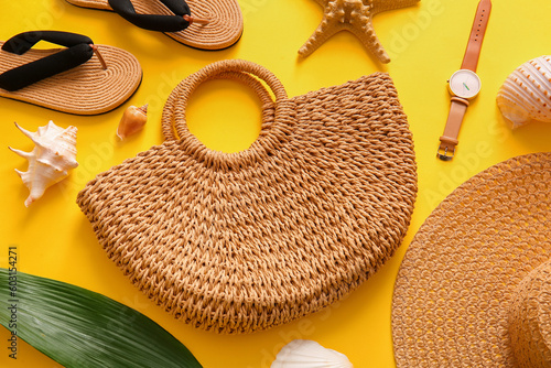 Obraz na plátně Composition with raffia bag, flip flops and shells on yellow background