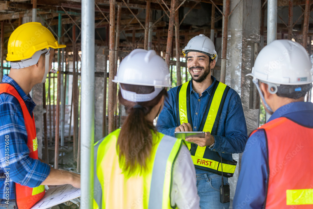 Team of engineer, architect, contractor and foreman meeting and consulting in construction building site for inspection in real estate development project industry and specification quality control Team of engineer, architect, contractor and foreman meeting and consulting in construction building site for inspection in real estate development project industry and specification quality control
