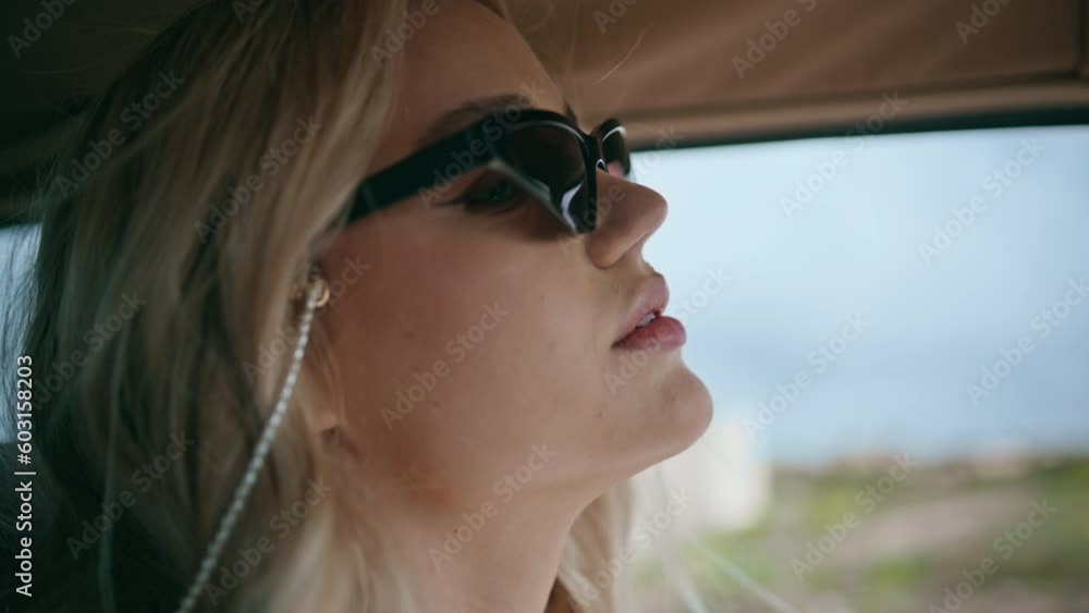 Gorgeous traveler riding automobile in sunglasses close up. Girl driving highway Gorgeous traveler riding automobile in sunglasses close up. Girl driving highway