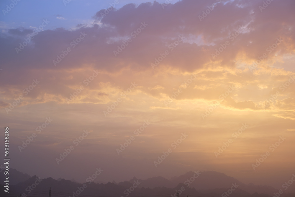 Sunset landscape with dark mountain peaks in egyptian desert