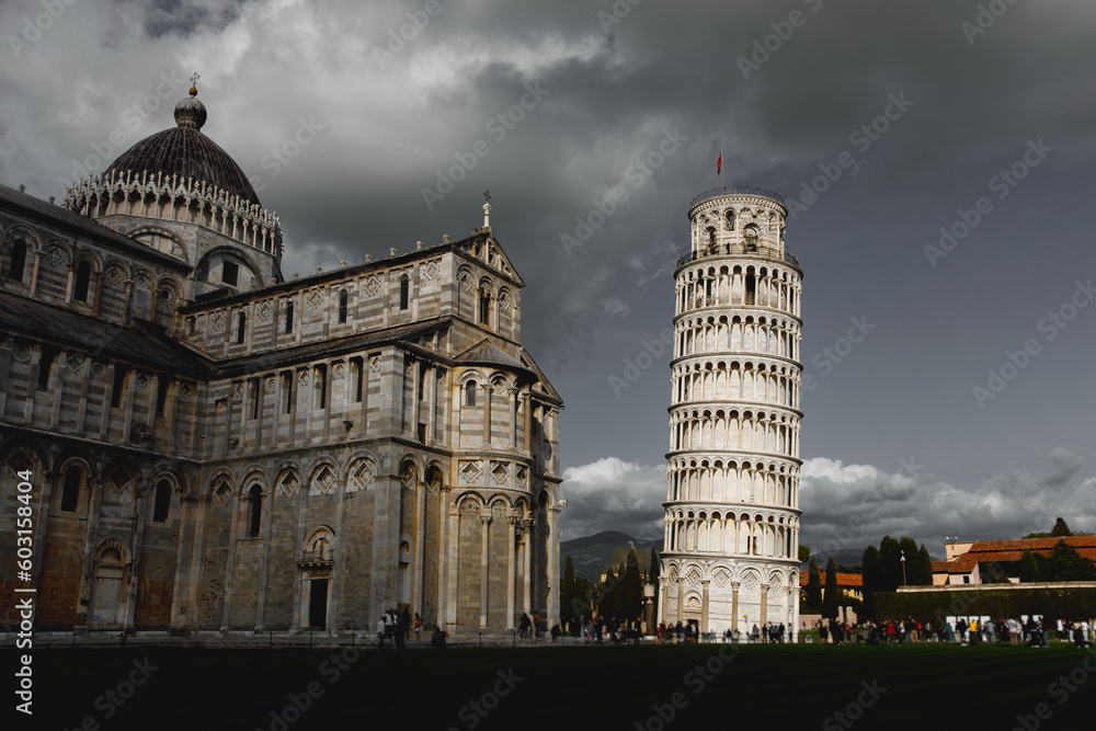 Dramatic clouds over the famous Pisa Tower. One of the most popular tourist places in the world.