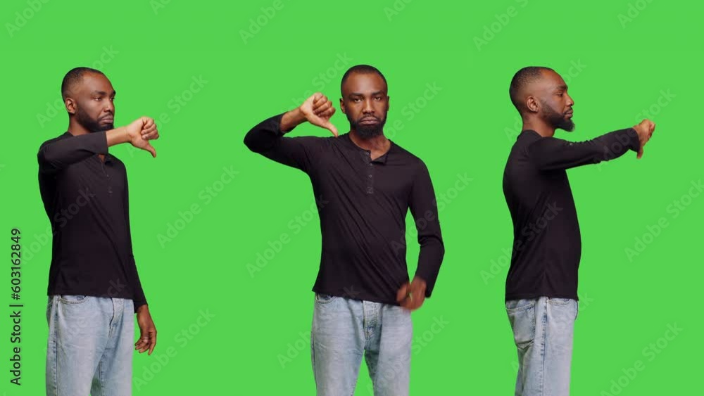African american man showing thumbs down sign on camera, giving dislike and negative gesture. Male model posing with disapproval rejection and disagreement in studio, displeased person. African american man showing thumbs down sign on camera, giving dislike and negative gesture. Male model posing with disapproval rejection and disagreement in studio, displeased person.