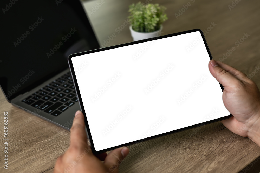 Digital tablet computer close up man using tablet hands man multitasking with isolated screen Digital tablet computer close up man using tablet hands man multitasking with isolated screen