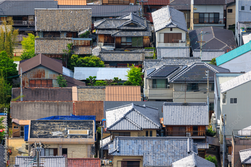 Looking down on roofs of old houses in small town Japan