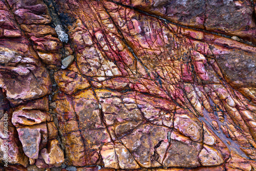 A close-up of a rock formation with beautiful red and orange colours © IgniteImage
