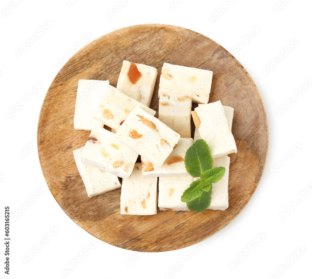 Pieces of delicious nougat and mint isolated on white, top view