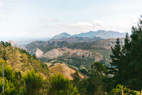 View of a valley full of mountains and trees in the morning in Mirador del fito, Asturias, Spain