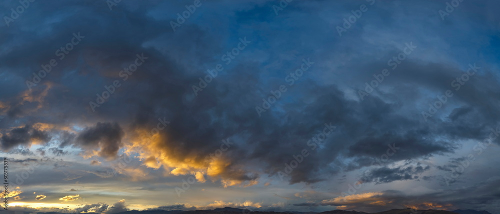 Russia. South of Western Siberia. Gloomy sunset clouds in the evening summer sky over the mountain ranges of Altai.