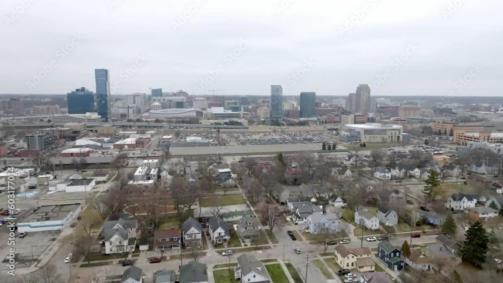 Neighborhood in Grand Rapids, Michigan and wide shot of Grand Rapids skyline with drone video moving in a circle. Neighborhood in Grand Rapids, Michigan and wide shot of Grand Rapids skyline with drone video moving in a circle.