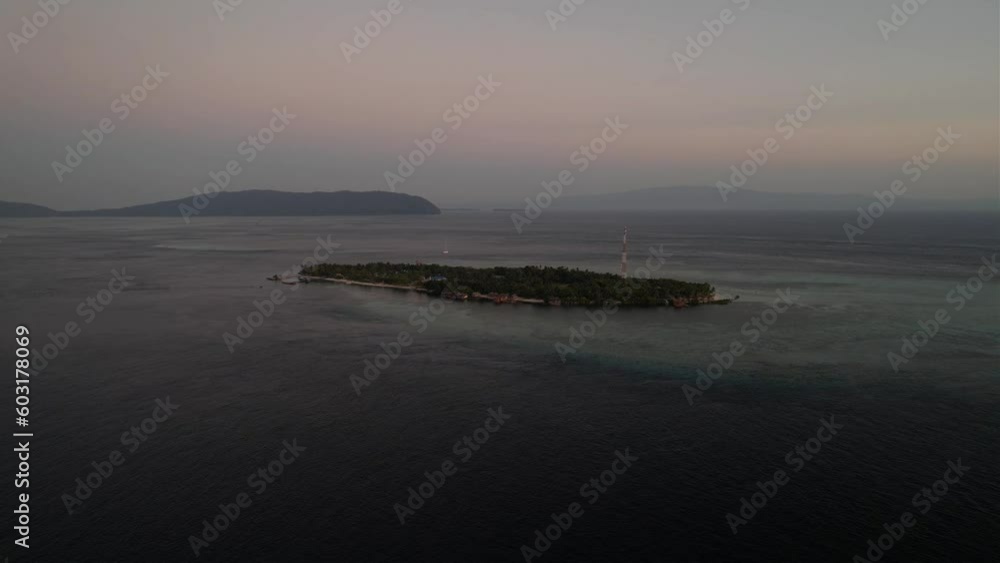 Closer shot of Arborek Island during sunset In Raja Ampat Indonesia Closer shot of Arborek Island during sunset In Raja Ampat Indonesia