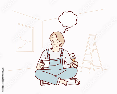 smiling woman painting at home, holding paint brush. Hand drawn style vector design illustrations.