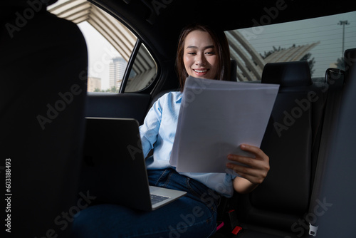 Young Asian woman with car