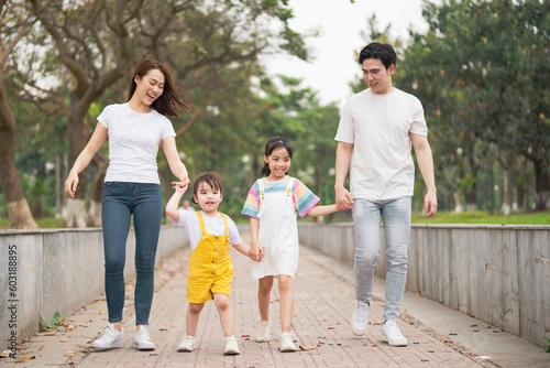 Young Asian family in the park